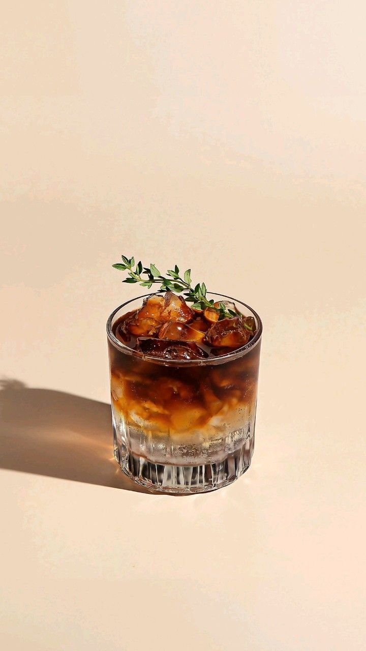 Espresso tonic with a thyme sprig