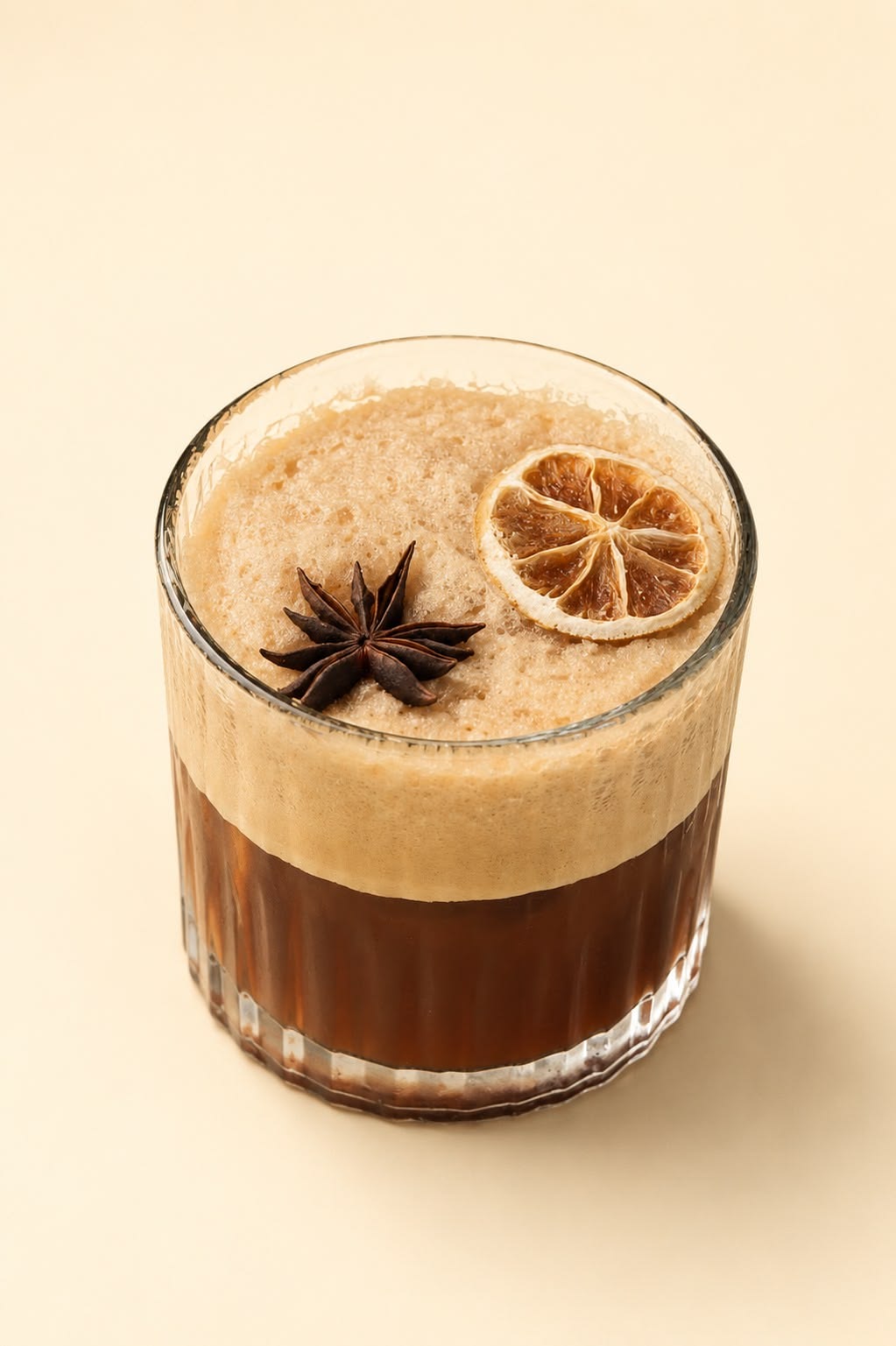 Spiced coffee with cinnamon foam, star anise and dried lime